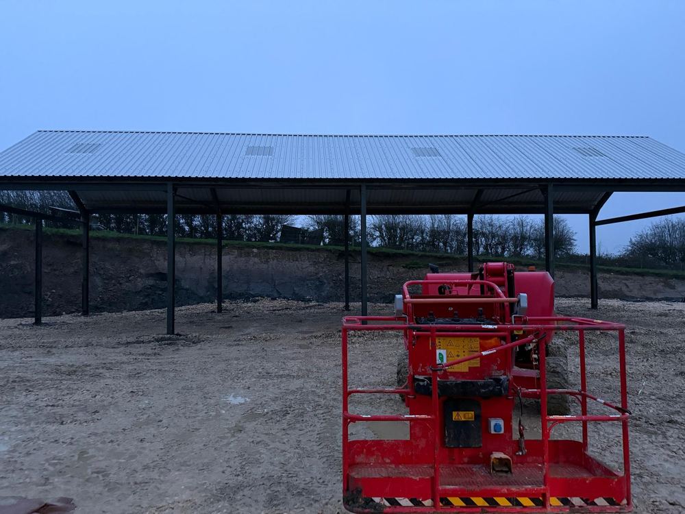 Steel-frame barn with roof sheeting